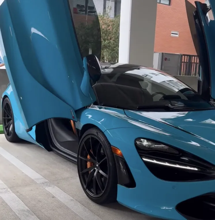 Blue McLaren 720S with doors up